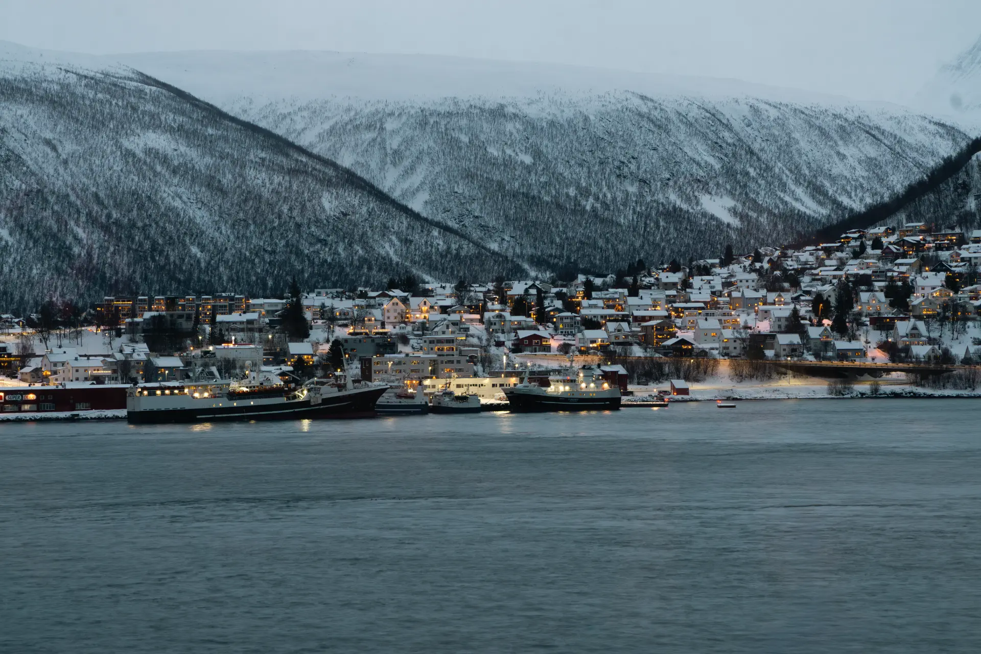 Snow-covered harbour of Tromsø, landscape photography for hospitality brands
